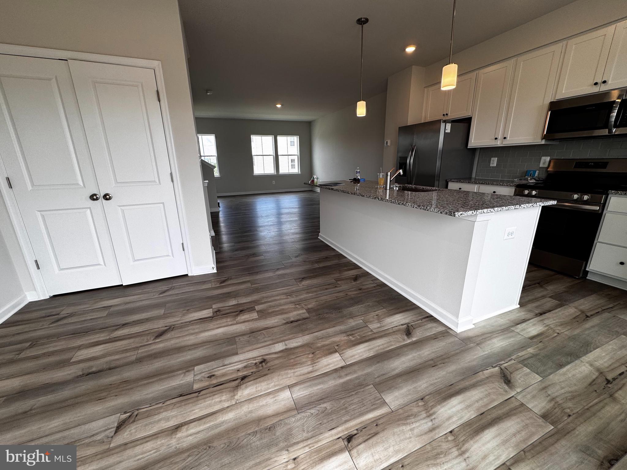 1258 Red Clover Lane Ranson, WV 25438 - Photo 9 of 25 a view of kitchen with microwave and cabinets