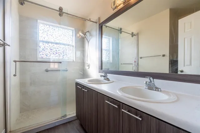 a bathroom with a sink and a mirror