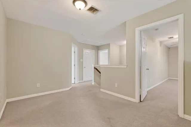 an empty room with closet area