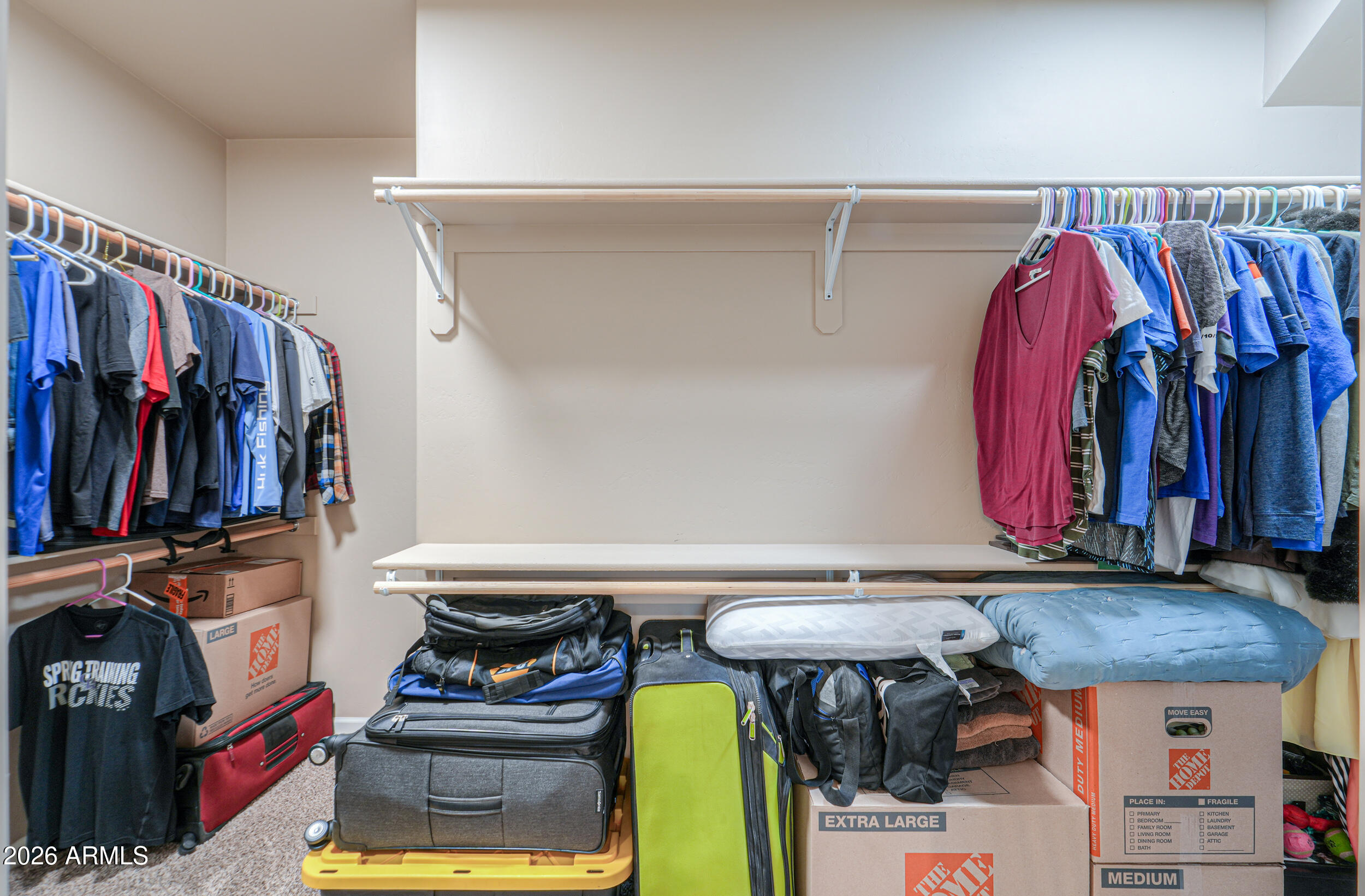 1487 South Mountain View Road Apache Junction, AZ 85119 - Photo 21 of 60 a view of walk in closet with clothes