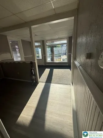 a view of gallery with wooden floor