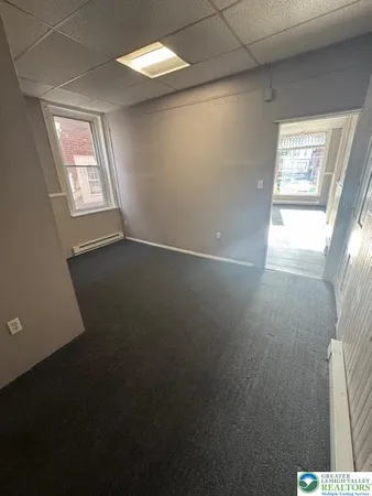 a view of an empty room and a windows