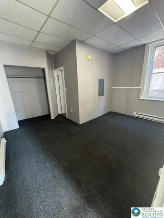 a view of an empty room with a window