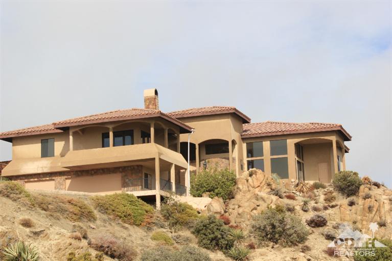 53966 Ridge Road Yucca Valley, CA 92284 - Photo 1 of 20 a front view of a house with a yard