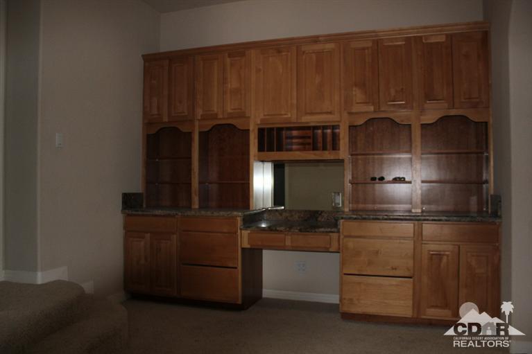 53966 Ridge Road Yucca Valley, CA 92284 - Photo 11 of 20 a kitchen with kitchen island a counter top space and cabinets