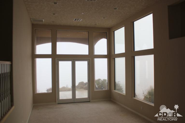 53966 Ridge Road Yucca Valley, CA 92284 - Photo 12 of 20 a view of an empty room with a window