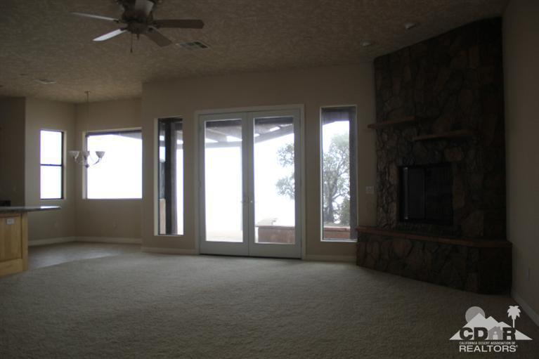 53966 Ridge Road Yucca Valley, CA 92284 - Photo 13 of 20 a view of an empty room with a window