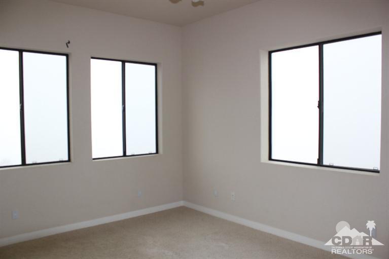 53966 Ridge Road Yucca Valley, CA 92284 - Photo 17 of 20 an empty room with a window