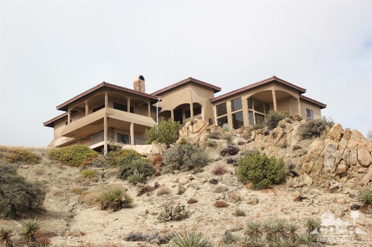 53966 Ridge Road Yucca Valley, CA 92284 - Photo 3 of 20 a front view of a house with a yard