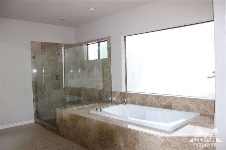 53966 Ridge Road Yucca Valley, CA 92284 - Photo 6 of 20 a bath tub sitting next to a bathroom sink