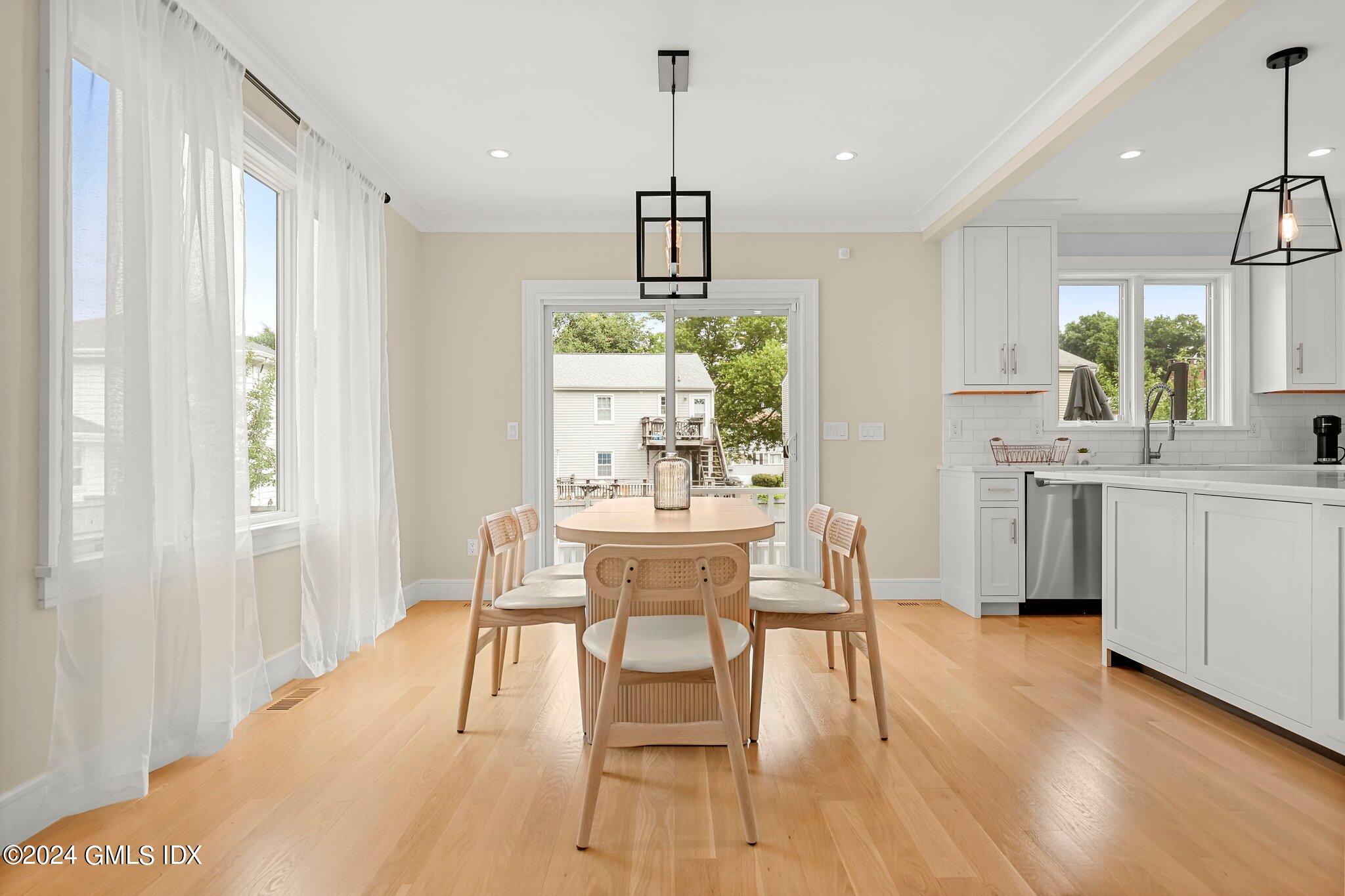 42 Richland Road Greenwich, CT 06830 - Photo 3 of 21 a view of a dining room with furniture window and wooden floor