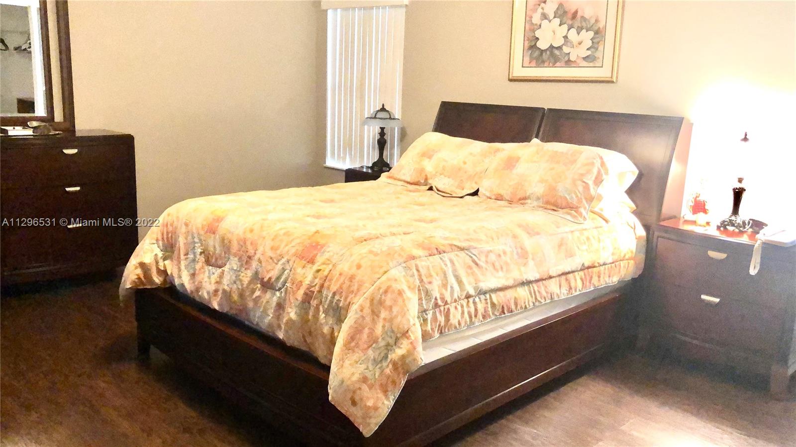 Savanna Weston, FL 33327 - Photo 4 of 7 a bed sitting in a bedroom next to a window