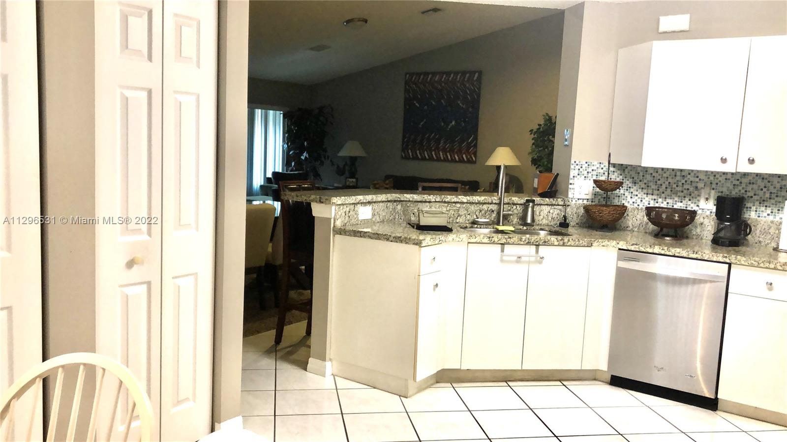 Savanna Weston, FL 33327 - Photo 5 of 7 a kitchen with a sink and cabinets