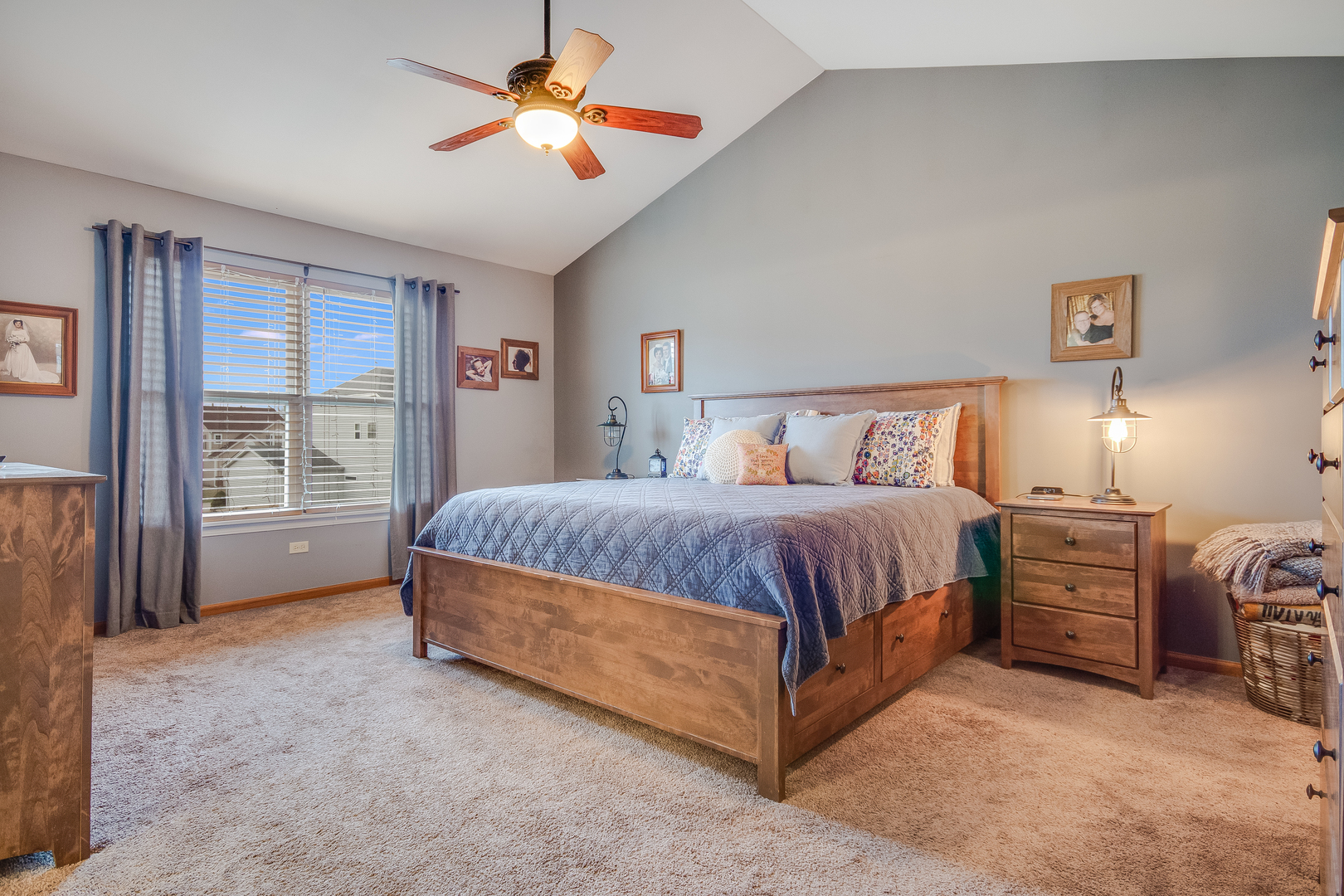 7654 Pin Oak Court Plainfield, IL 60586 - Photo 22 of 41 a spacious bedroom with a bed and a chandelier