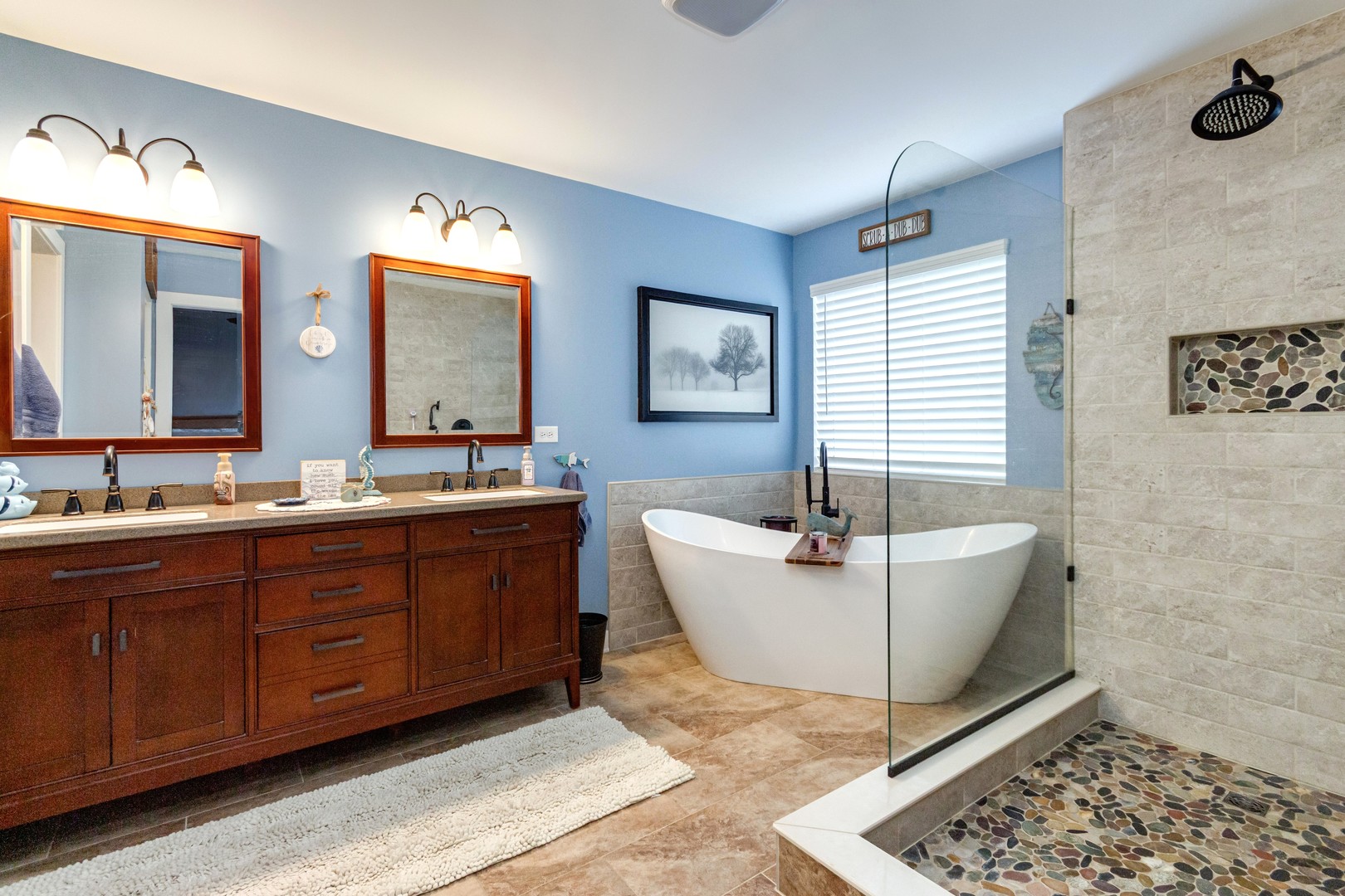 7654 Pin Oak Court Plainfield, IL 60586 - Photo 24 of 41 a spacious bathroom with a tub sink and mirror