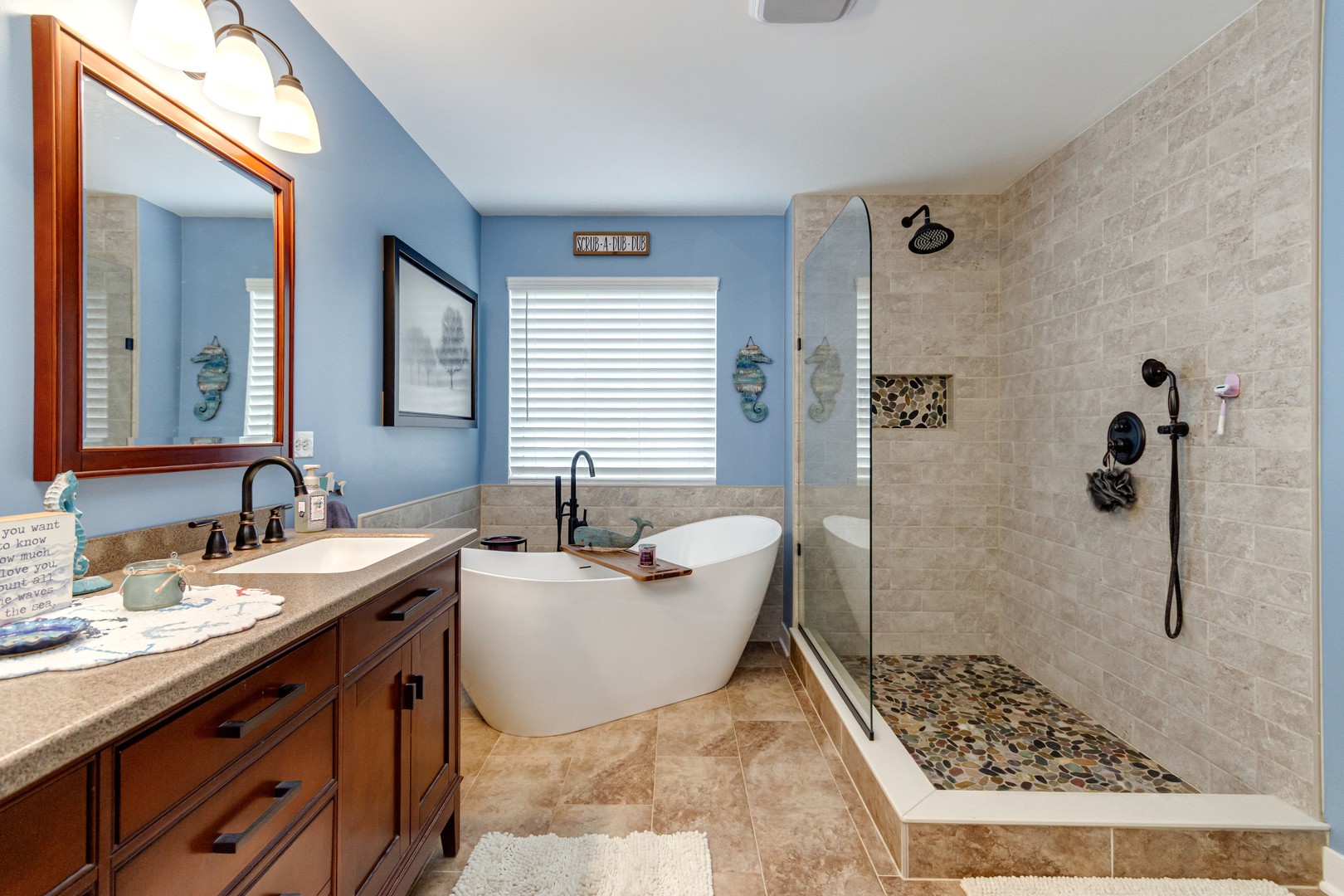 7654 Pin Oak Court Plainfield, IL 60586 - Photo 25 of 41 a bathroom with a sink a toilet a mirror and shower