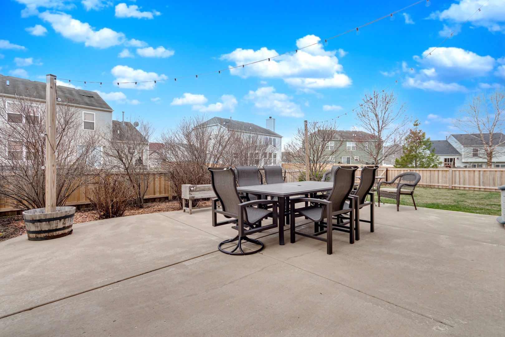 7654 Pin Oak Court Plainfield, IL 60586 - Photo 33 of 41 a view of a patio with a table and chairs