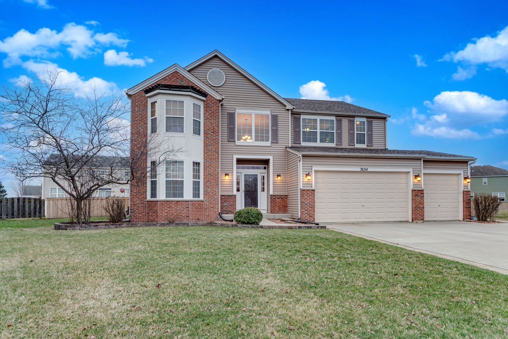 7654 Pin Oak Court Plainfield, IL 60586 - Photo 38 of 41 a front view of a house with a yard