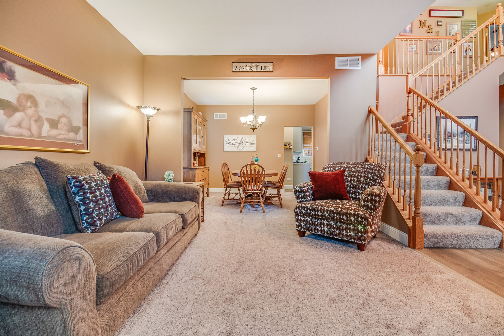 7654 Pin Oak Court Plainfield, IL 60586 - Photo 4 of 41 a living room with furniture and a chandelier