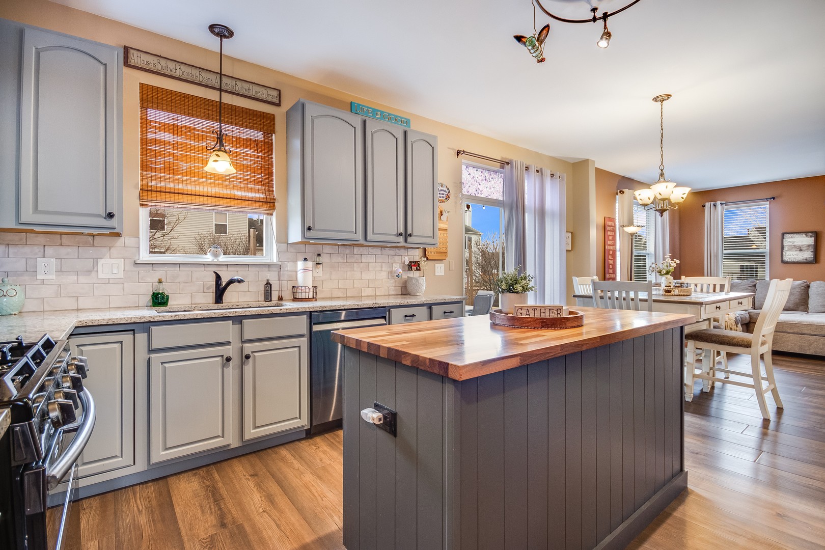7654 Pin Oak Court Plainfield, IL 60586 - Photo 9 of 41 a kitchen with a sink stove and cabinets