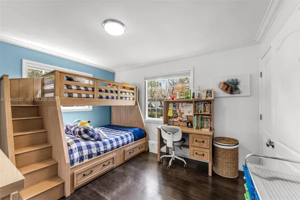 a bedroom with a bed and a chair