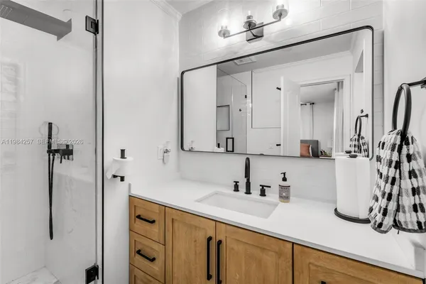 a bathroom with a sink and a mirror