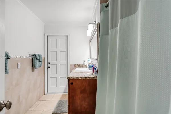 a bathroom with a sink and mirror
