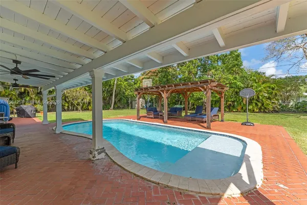 a view of a swimming pool with a patio
