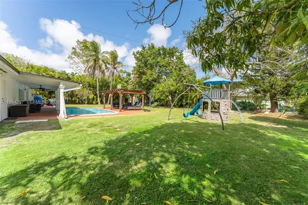 a view of a park with a slide