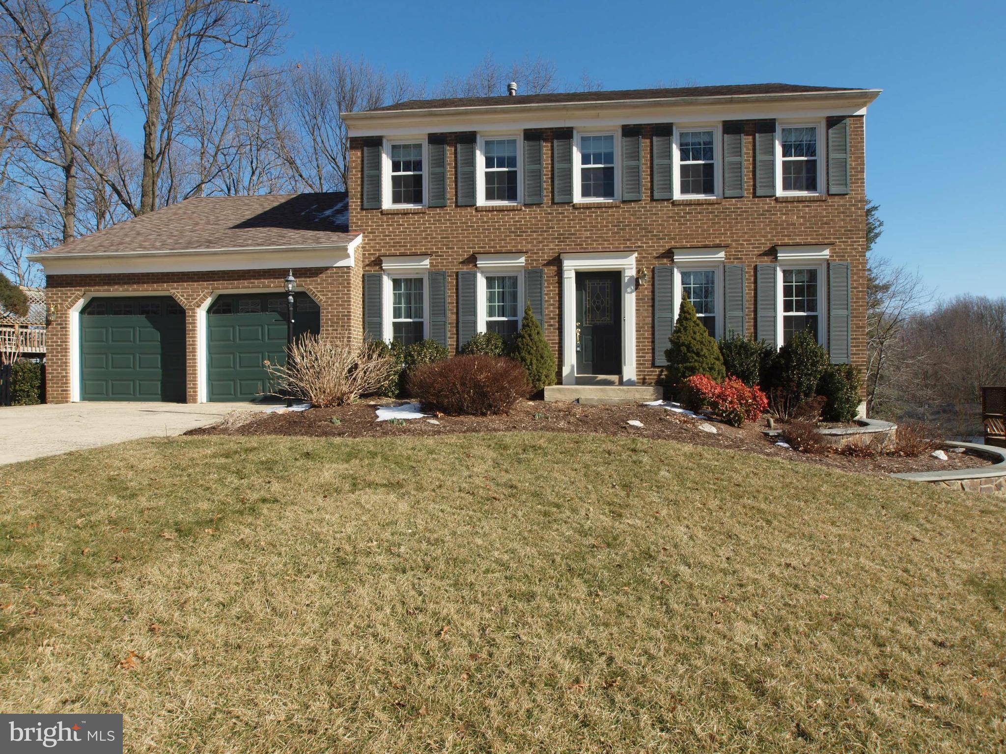 a front view of building with yard