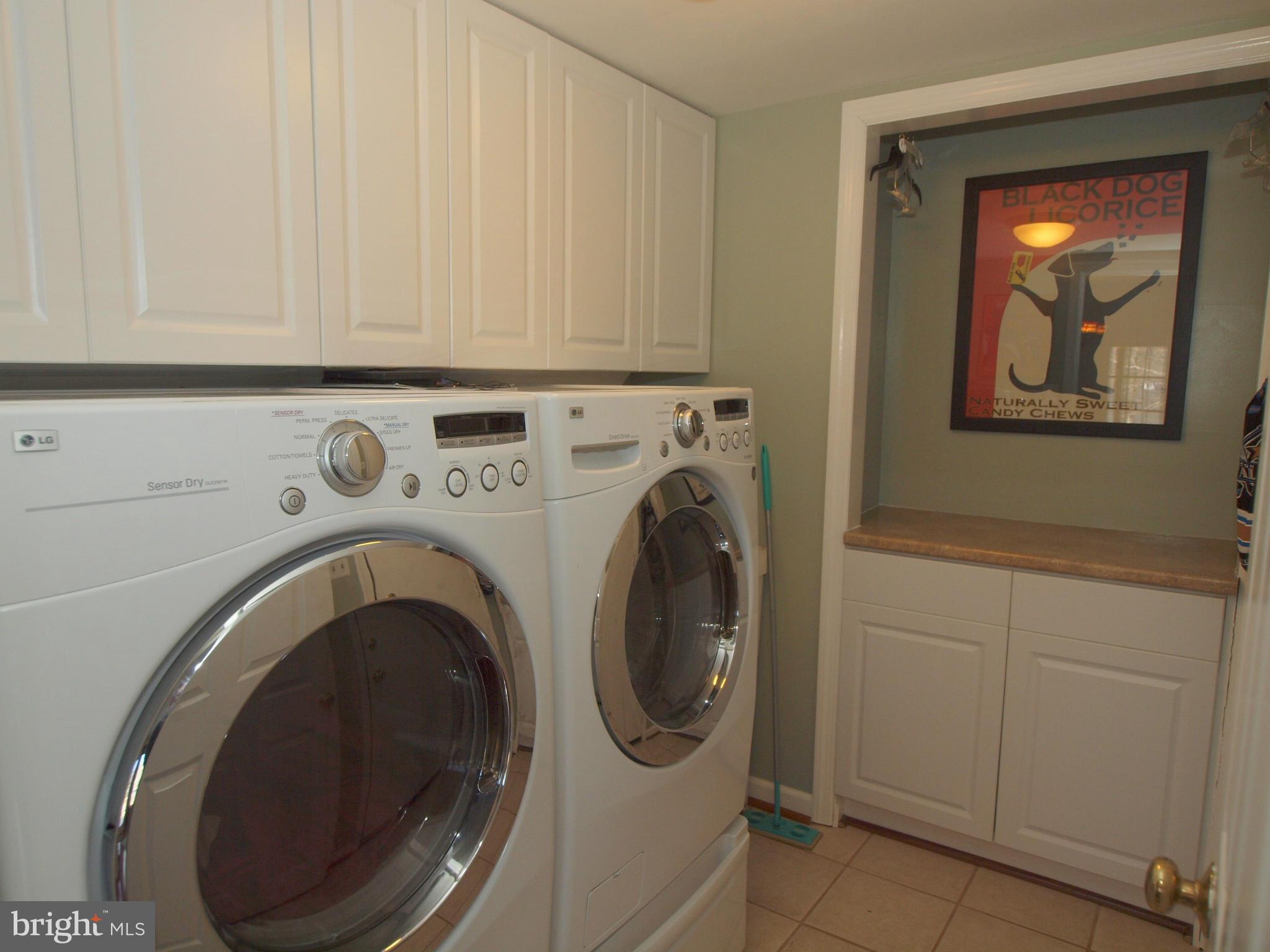6823 Spring Beauty Court Springfield, VA 22152 - Photo 11 of 29 a utility room with dryer and washer