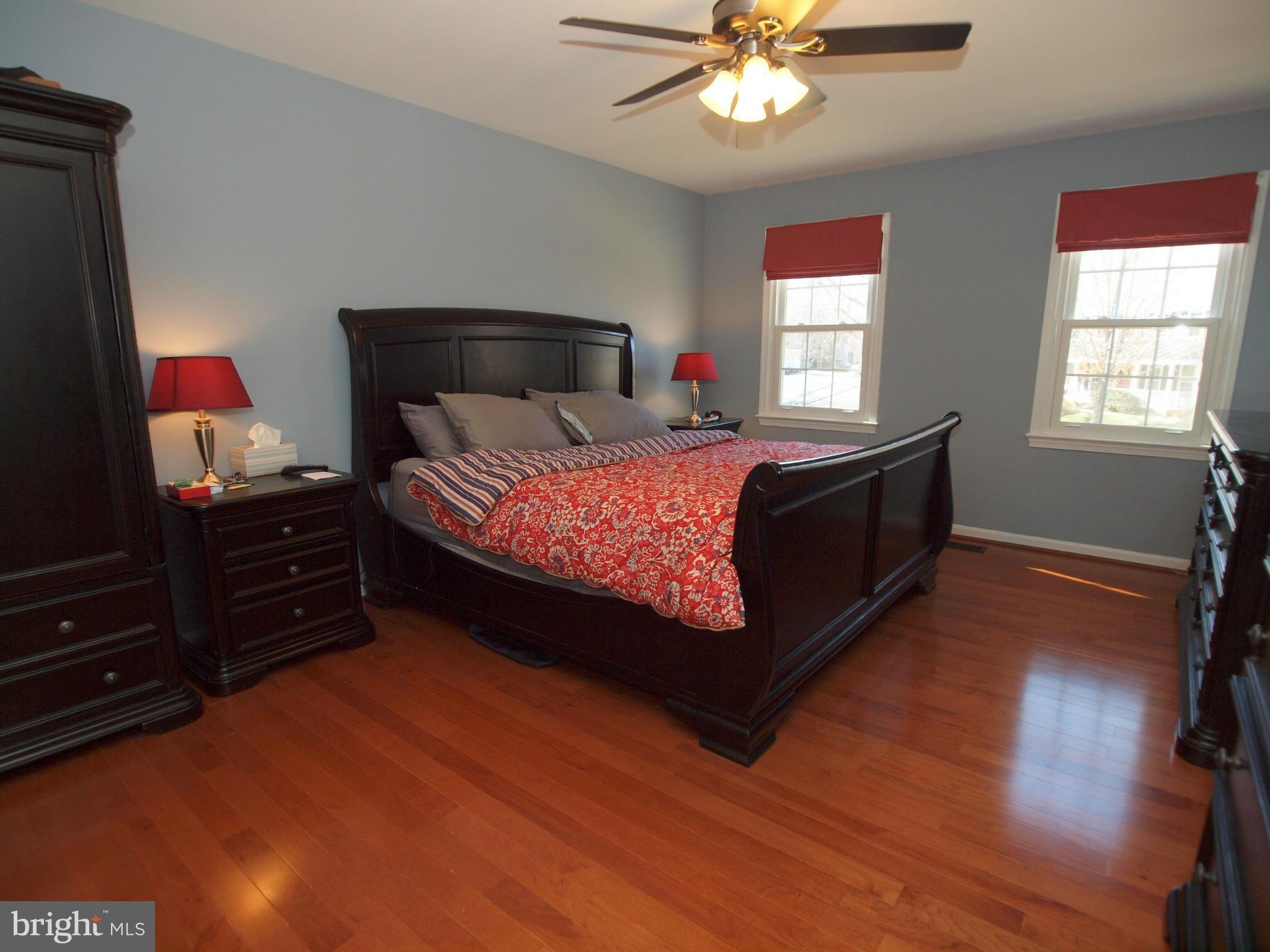 6823 Spring Beauty Court Springfield, VA 22152 - Photo 12 of 29 a bed room with a bed and a window
