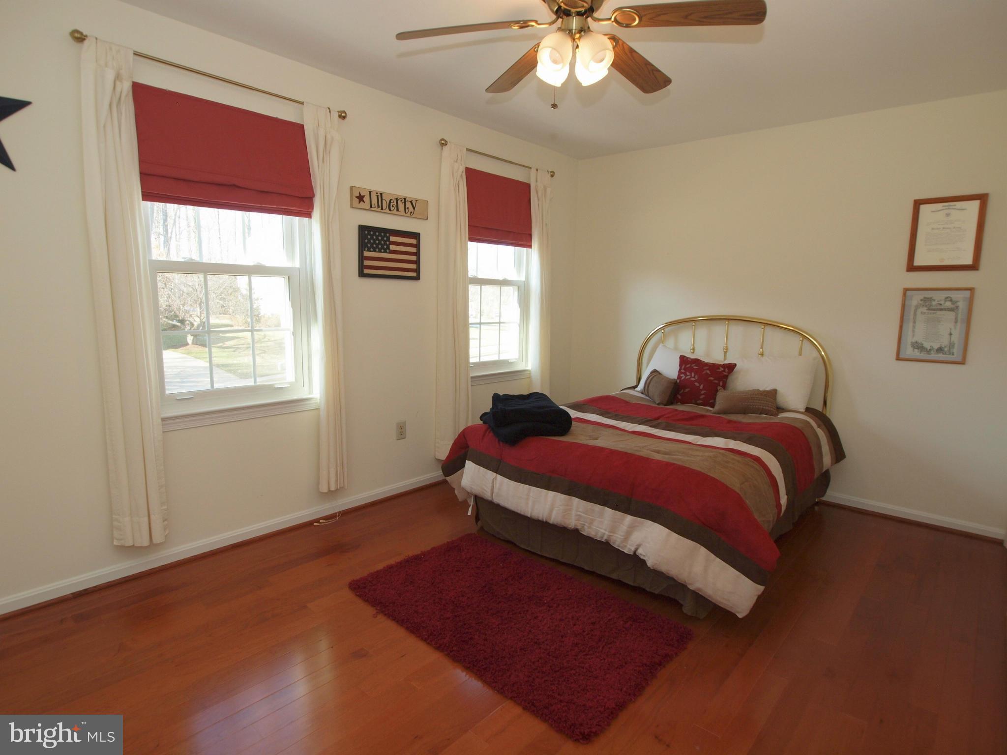 6823 Spring Beauty Court Springfield, VA 22152 - Photo 19 of 29 a bedroom with a bed and a window