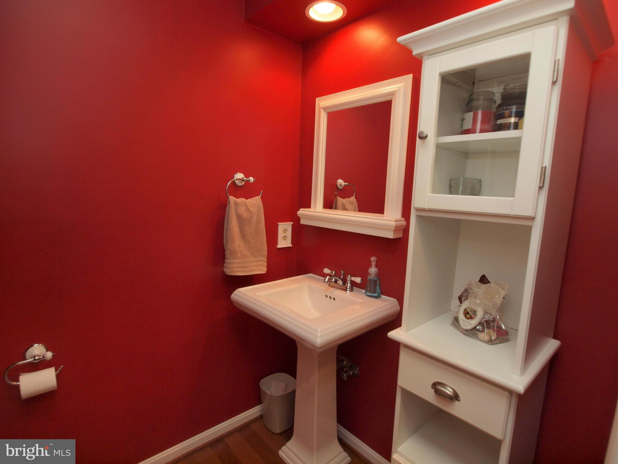 6823 Spring Beauty Court Springfield, VA 22152 - Photo 3 of 29 a bathroom with a sink mirror and vanity