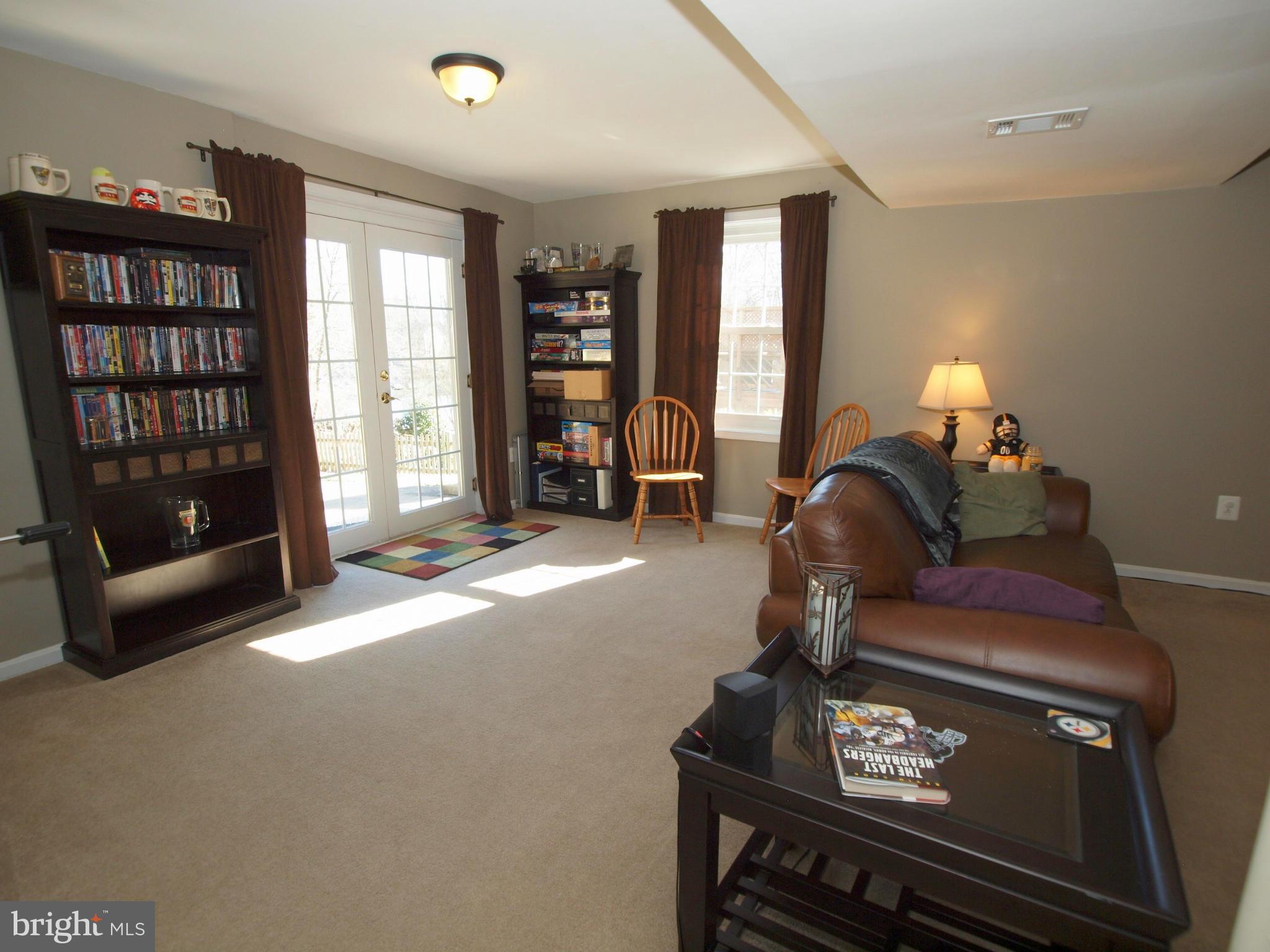 6823 Spring Beauty Court Springfield, VA 22152 - Photo 21 of 29 a living room with furniture a walk in closet and a window