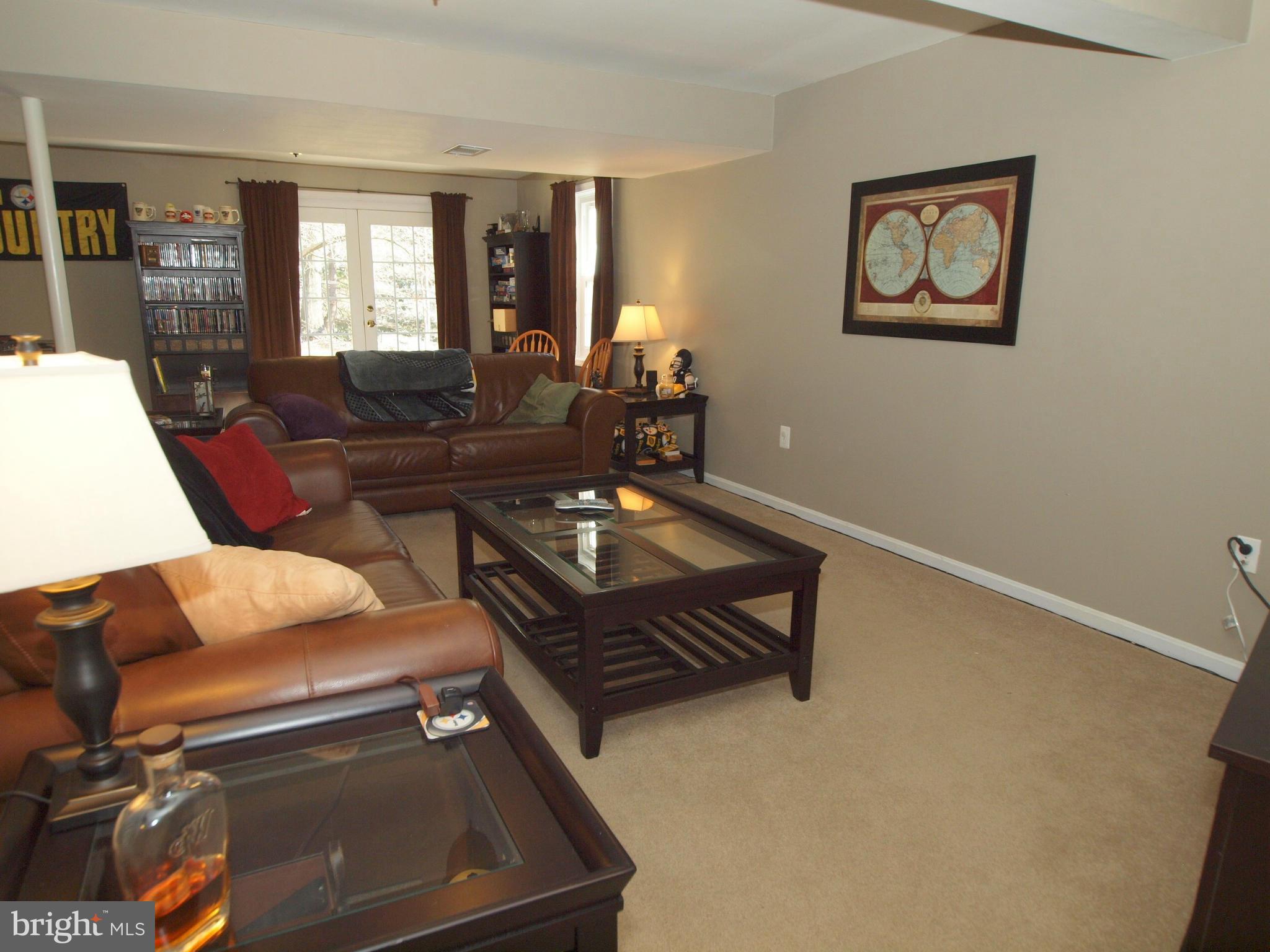 6823 Spring Beauty Court Springfield, VA 22152 - Photo 22 of 29 a living room with furniture and a window