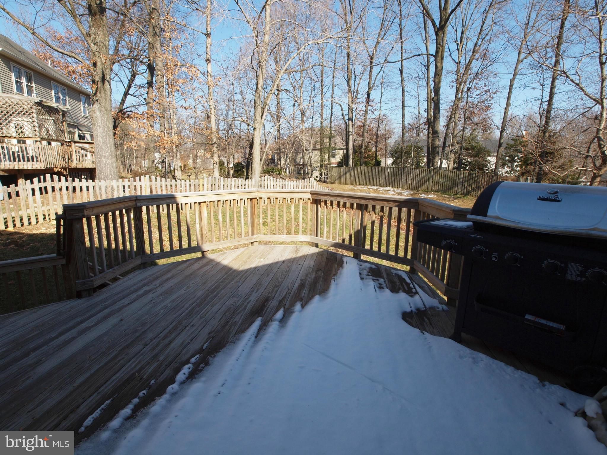 6823 Spring Beauty Court Springfield, VA 22152 - Photo 24 of 29 a view of balcony with wooden floor and outdoor seating