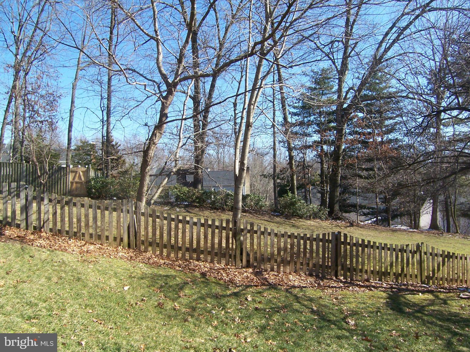 6823 Spring Beauty Court Springfield, VA 22152 - Photo 27 of 29 a view of a yard with wooden fence