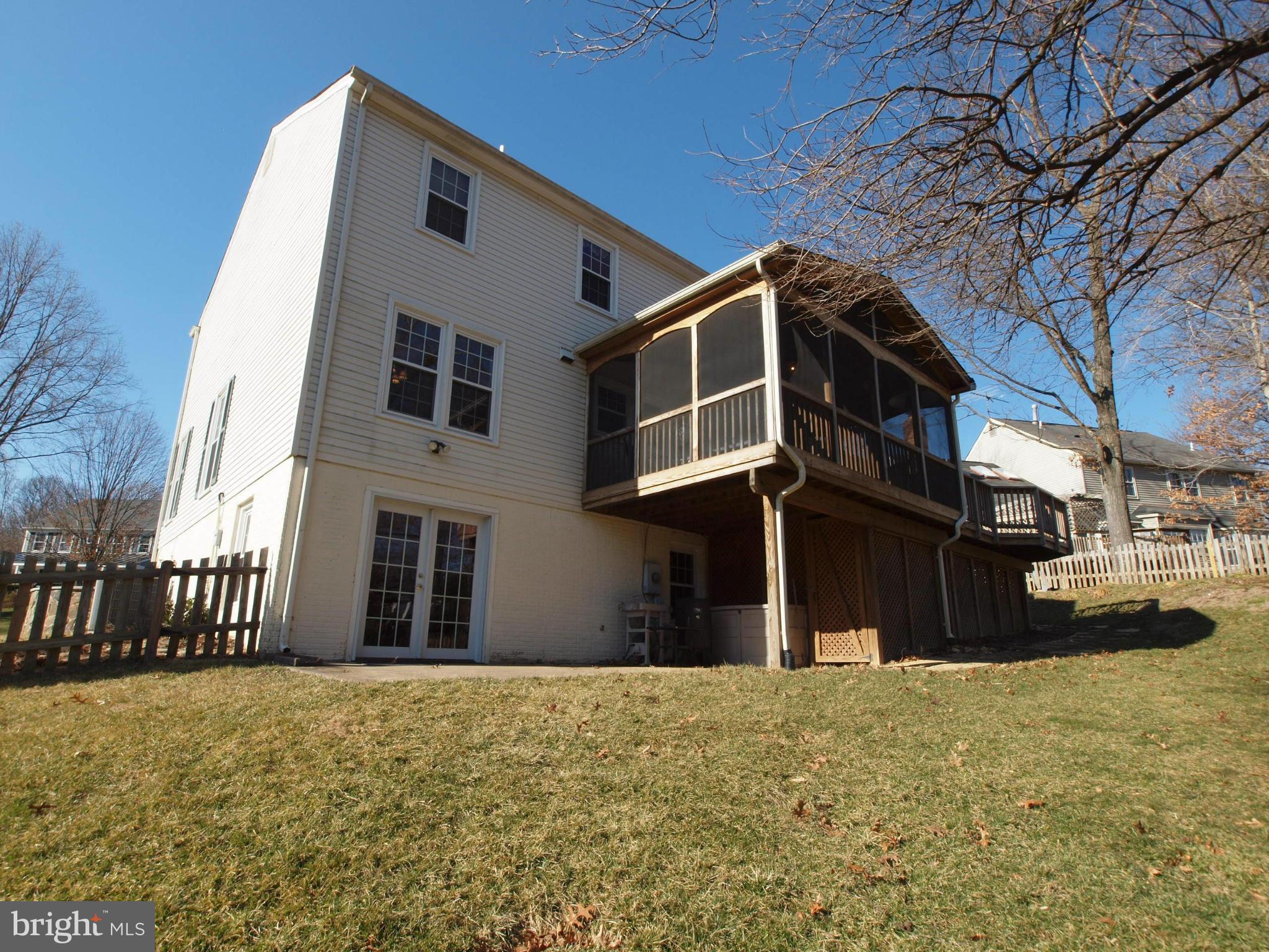 6823 Spring Beauty Court Springfield, VA 22152 - Photo 28 of 29 a front view of a house with a yard
