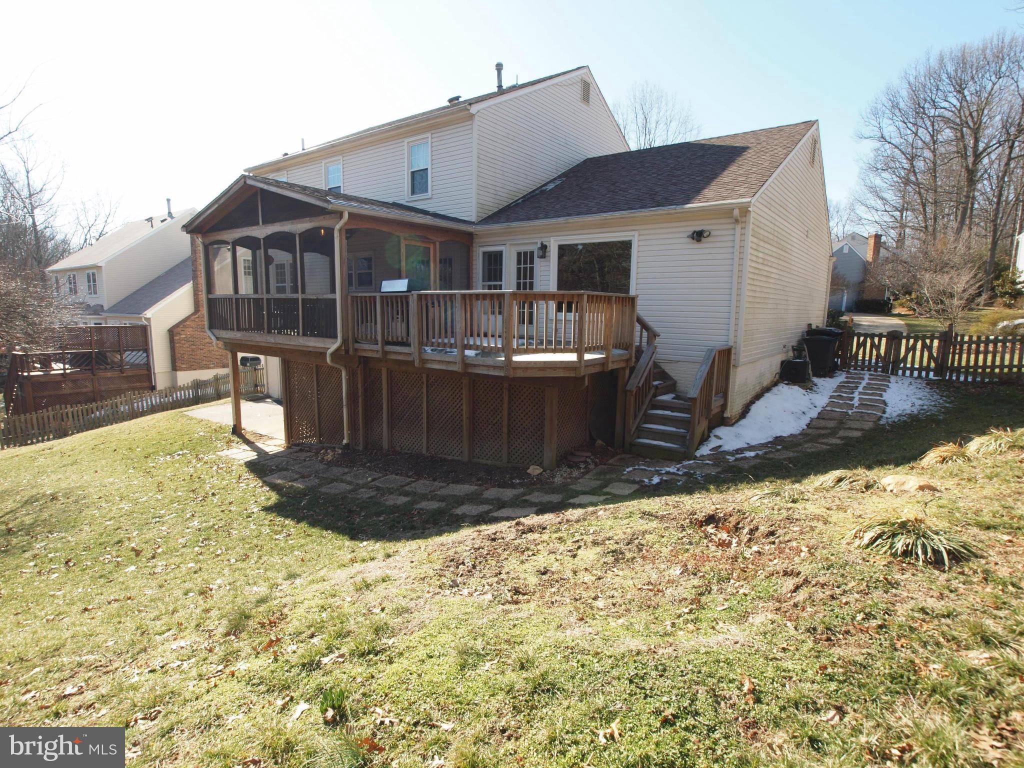 6823 Spring Beauty Court Springfield, VA 22152 - Photo 29 of 29 a view of a house with snow on the background