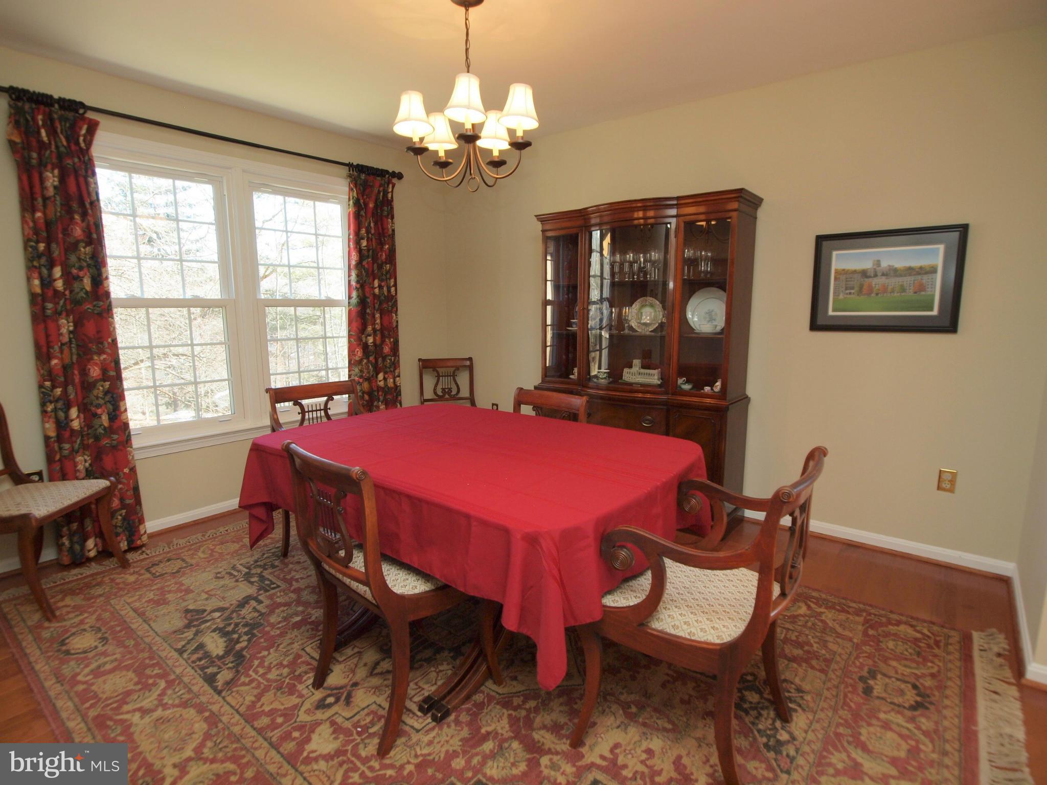 6823 Spring Beauty Court Springfield, VA 22152 - Photo 6 of 29 a view of a dining room with furniture and window