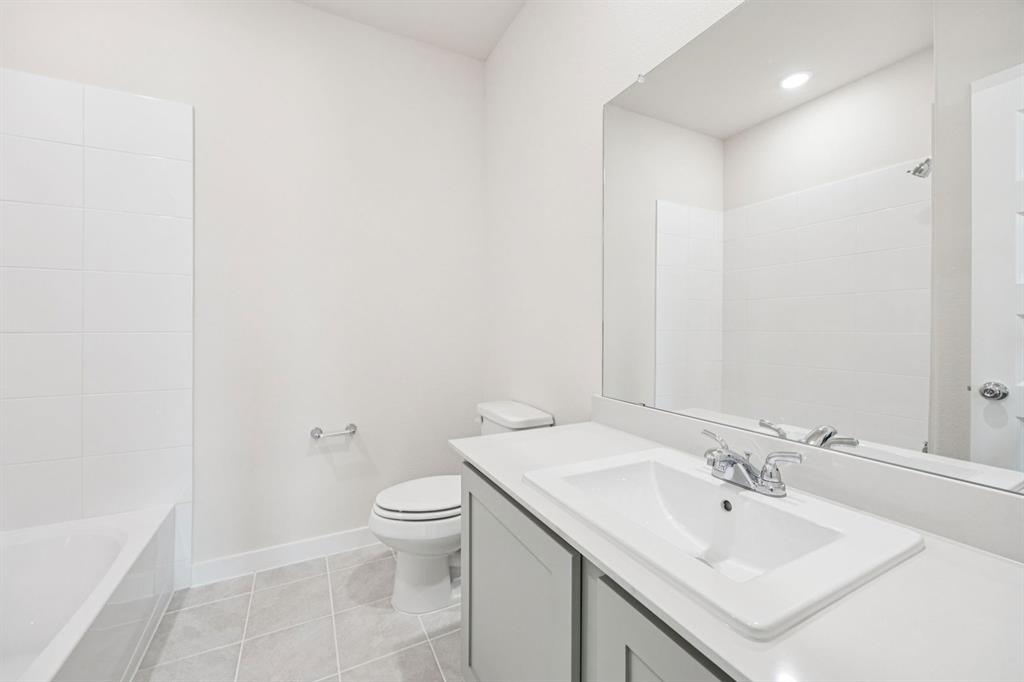 1127 Sunward Road Princeton, TX 75407 - Photo 17 of 29 a bathroom with a sink toilet and shower