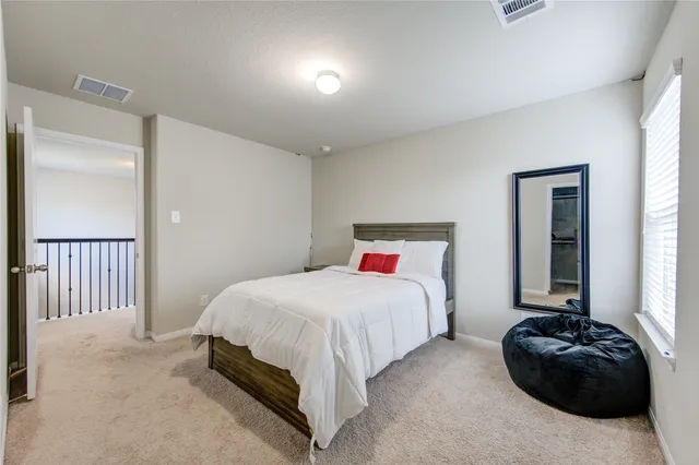 a bedroom with a bed and closet