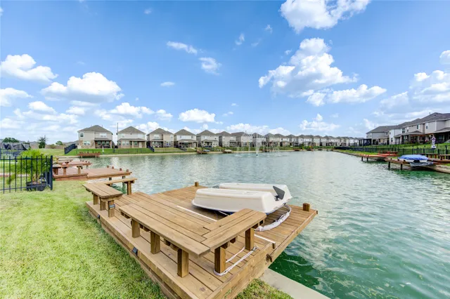 a view of a lake with houses in the background