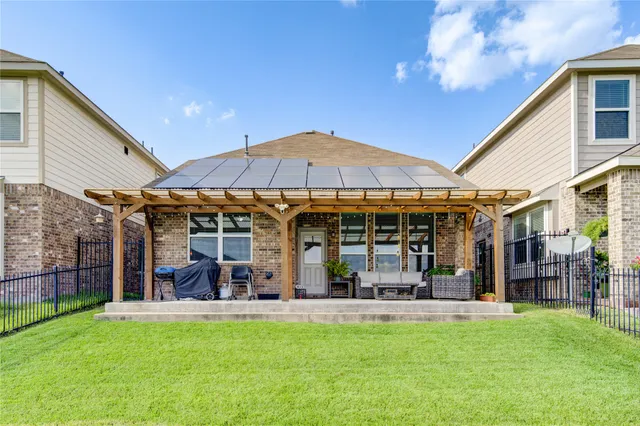 a view of people sitting in front of a house