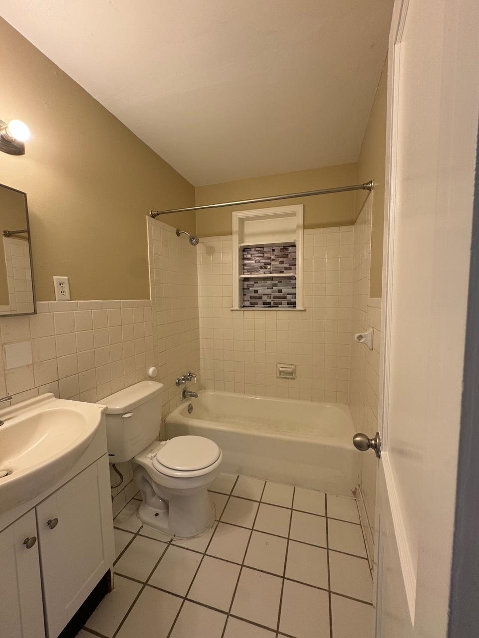 243 West Brooks Road Memphis, TN 38109 - Photo 17 of 19 a bathroom with a granite countertop sink toilet and shower