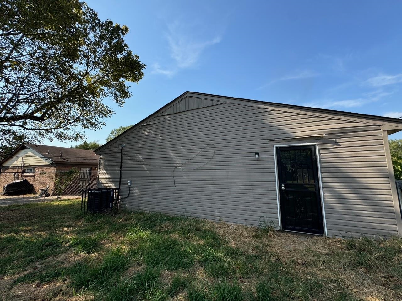243 West Brooks Road Memphis, TN 38109 - Photo 5 of 19 a front view of a house with a garden