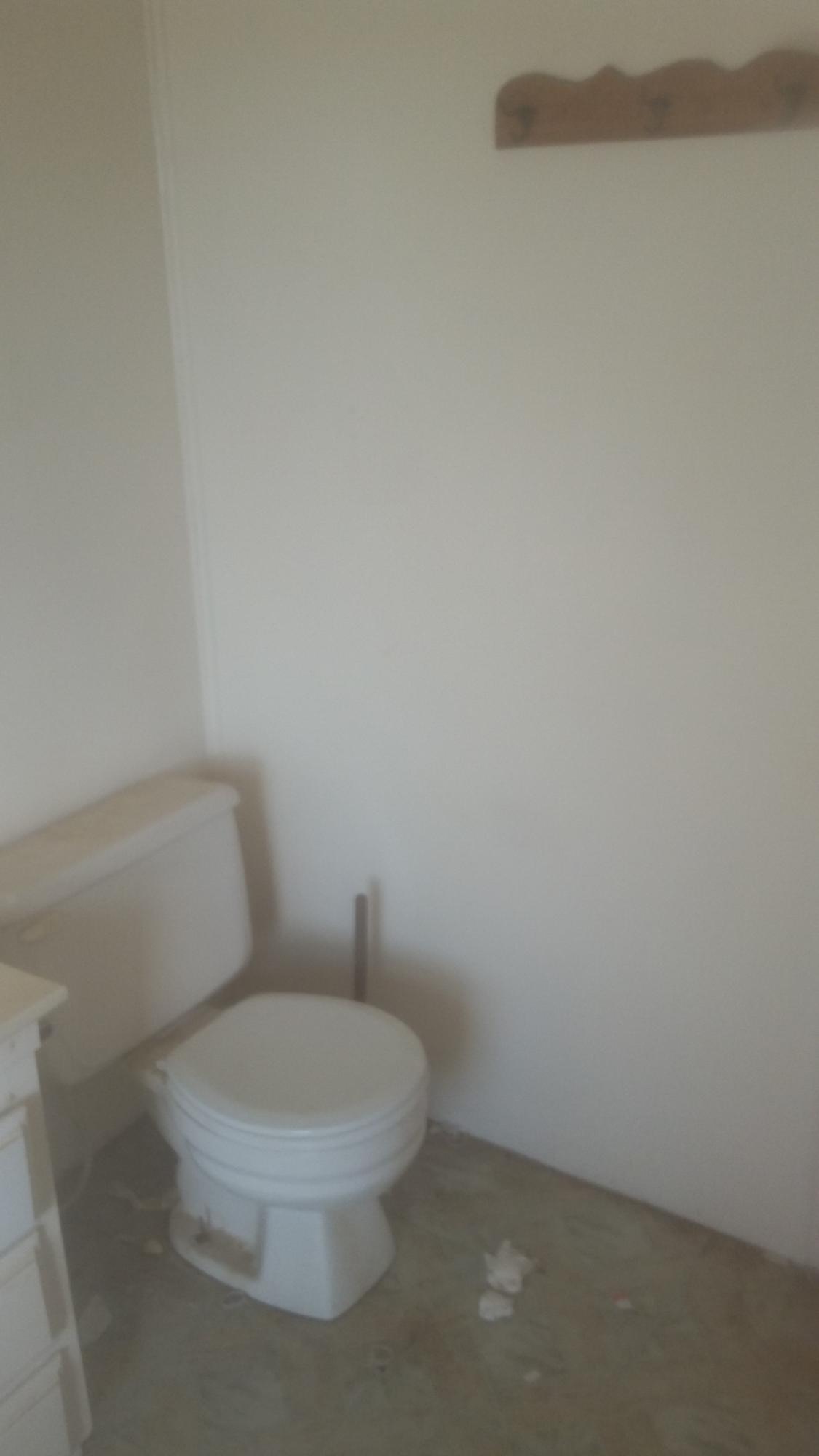 20825 Highline Road Tehachapi, CA 93561 - Photo 19 of 19 a white toilet sitting next to a white wall