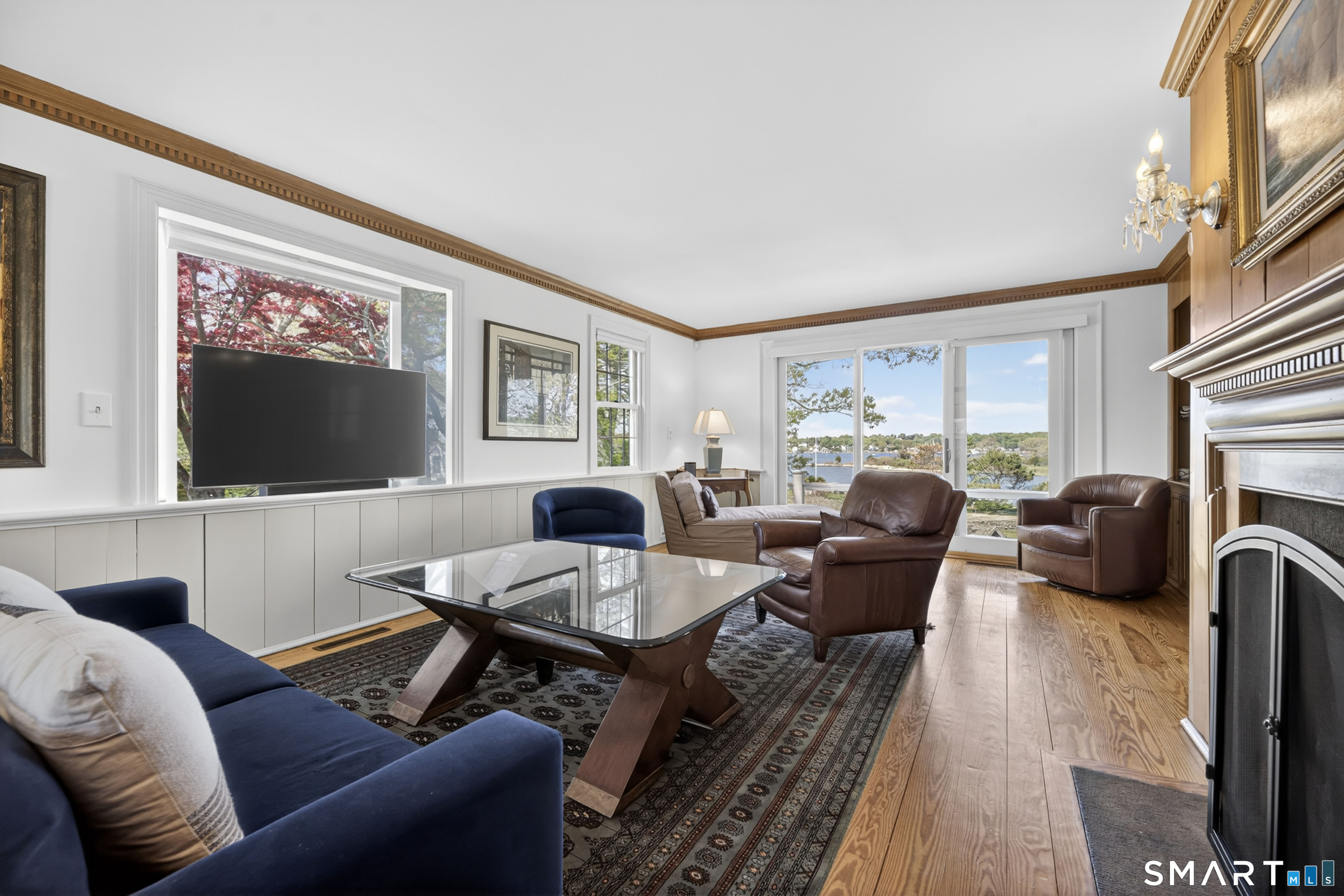 32 Money Point Road Stonington, CT 06355 - Photo 15 of 40 a living room with furniture a large window and a flat screen tv