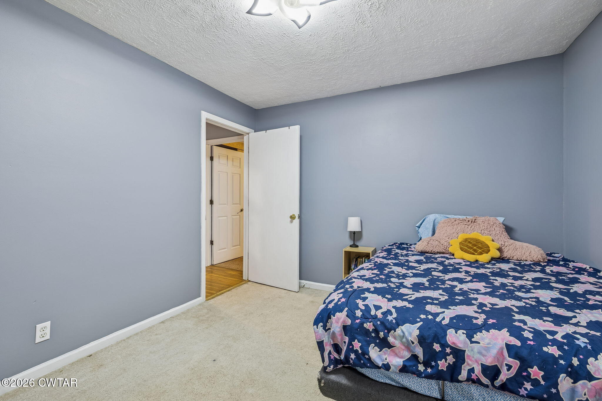 485 Lower Roans Creek Road Linden, TN 37096 - Photo 25 of 54 a bedroom with a bed and two lamp on desk
